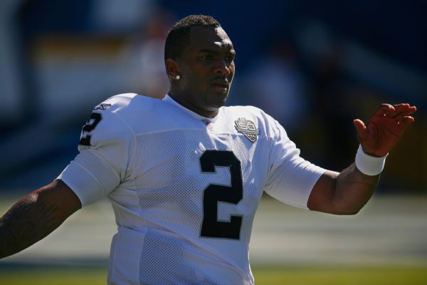 Former No. 1 pick JaMarcus Russell fired as coach, faces lawsuit